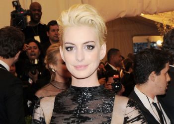 Anne Hathaway Debuts Platinum Locks At Met Gala