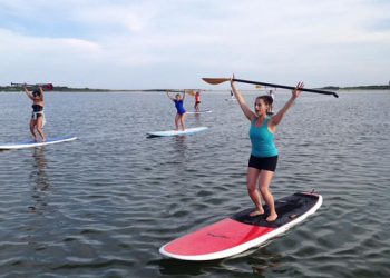 Hamptons Fitness Studio Combines SUP With Barre For New Summer Workout Class