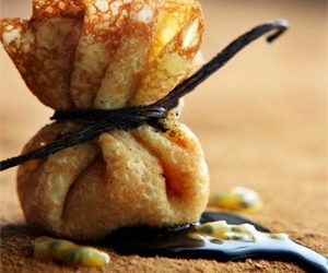Patissier Francois Payard’s Crepe Purse Filled With Sautéed Bananas With Passion Fruit And Chocolate Passion Sauce