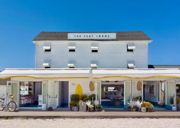 Blue sky background with the white, chic Surf Lodge in Montauk