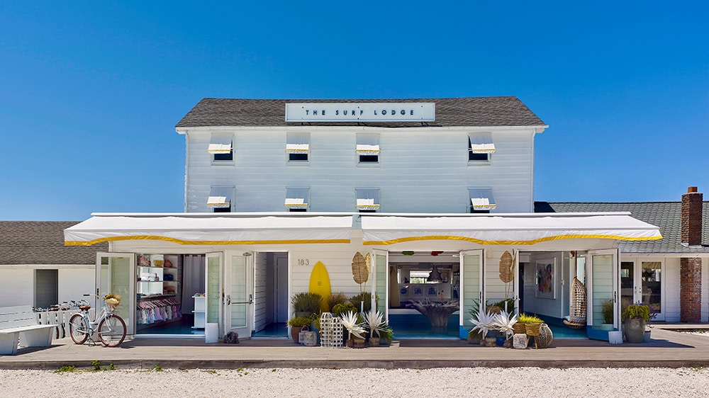 Blue sky background with the white, chic Surf Lodge in Montauk