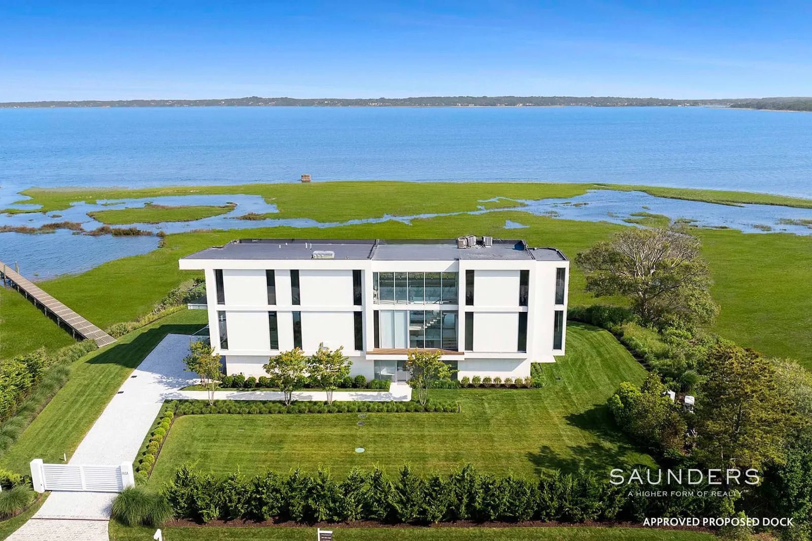 Now available, this extraordinary South of the Highway bayfront double-lot estate on Southampton Village's iconic Meadow Lane, has over 300' of waterfrontage, an approved dock, and sweeping panoramic vistas across Shinnecock Bay and ocean views.