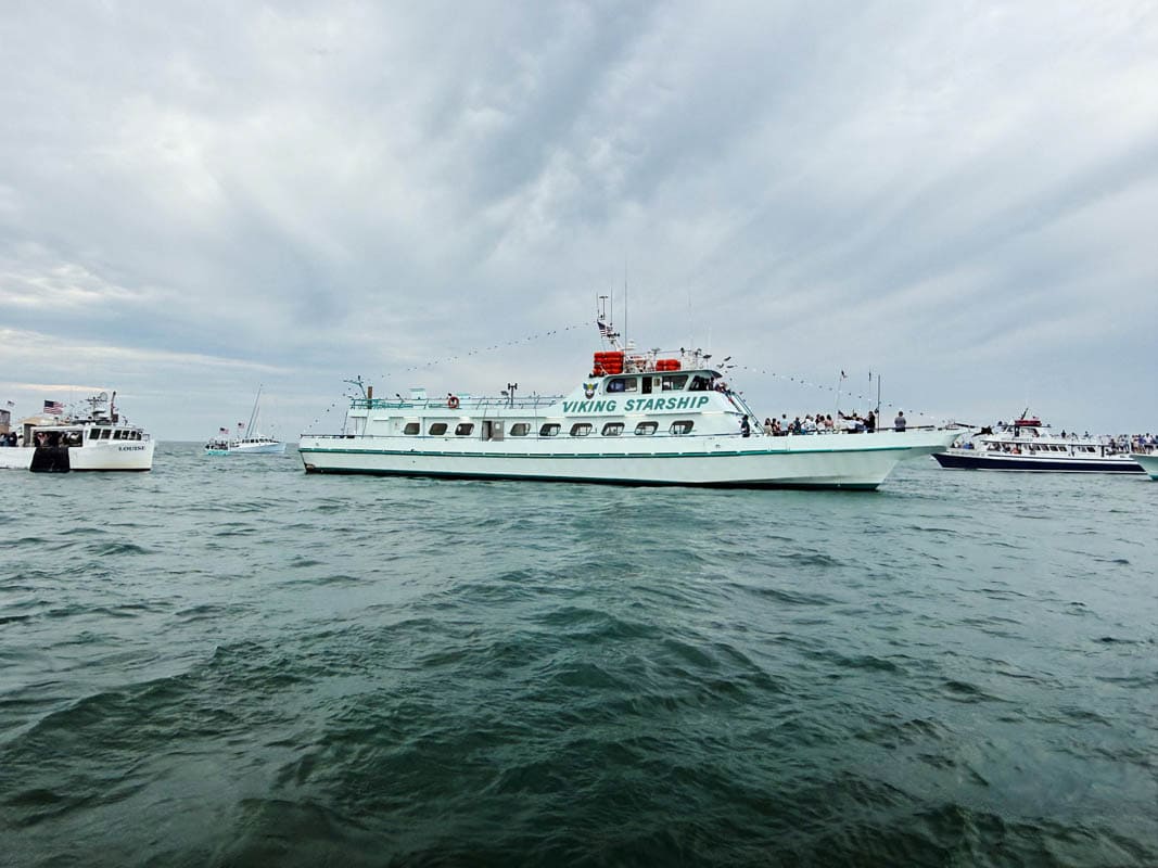 The Montauk commercial fishing fleet held its annual “Blessing of the Fleet” on Sunday, June 14th. The “Sea Gods” provided perfect conditions for this day of both thanks and blessings. The “Montauk Blessing of the Fleet” is one of the many traditions to help launch the East End season. This year, the blessings were given by Father Liam, the Catholic priest of Montauk’s “St Terese of Lisieux,” and by Pastor Bill of  the “Montauk Community Church.” They were aboard the VIKINGSTARSHIP.