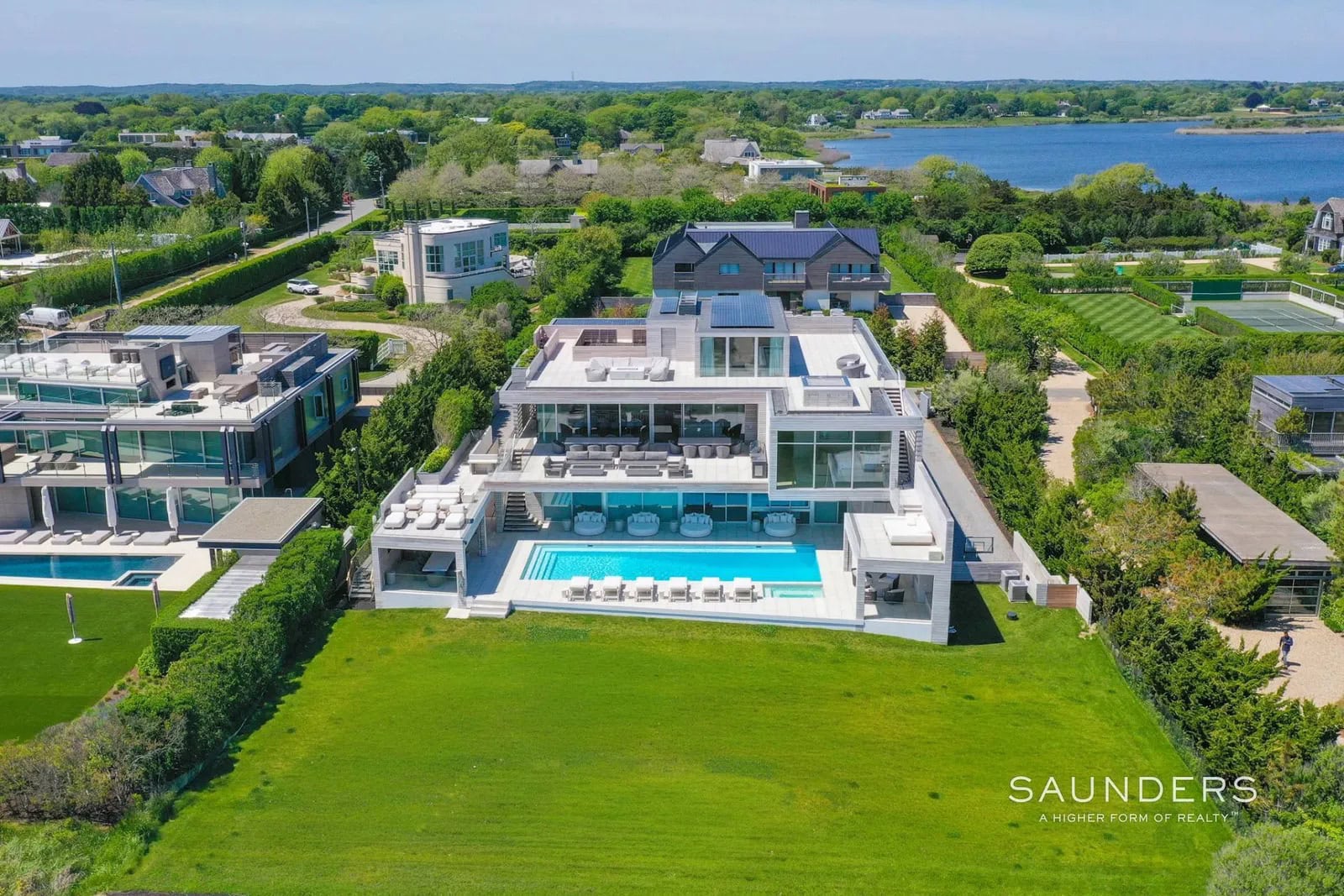 The ultimate in luxury, this magnificent custom oceanfront residence is like no other, the pinnacle of 21st-century design. Crafted to the most exacting standard with the finest materials, this grand residence affords a transcendent oceanfront living experience. In 11,000 sq. ft. of living space, there are 9 bedrooms, 10 full and 2 half baths, with living areas flowing seamlessly among indoor and outdoor dining areas, lounges, gathering places, kitchens, and entertainment spaces.