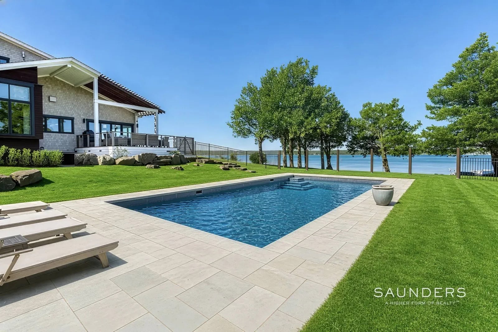 A once-in-a-lifetime Hamptons waterfront rental on Three Mile Harbor-an exceptionally private, never-before-available retreat with direct water access and approximately 200' of beachfront.