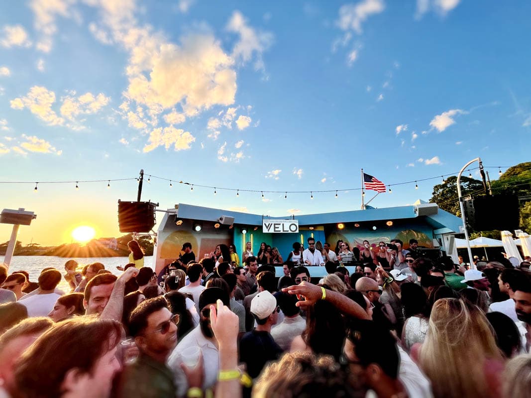 There are a few places in the Hamptons where you can feel the entire summer happening at once. But, standing on the deck at the Surf Lodge, sunlight and bass bouncing across the waters of Fort Pond in Montauk, the solstice may need to be reconsidered.