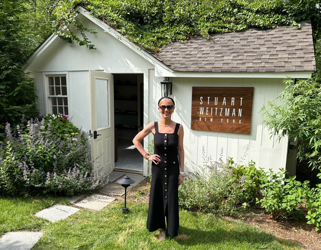 If you blinked while driving down Main Street in East Hampton this week, you might have missed it. Tucked behind a white-shingled cottage draped in ivy at The Maidstone Hotel, Stuart Weitzman quietly opened its first-ever Hamptons summer shopping installation, and it is exactly the kind of discovery that makes a summer out here feel special.