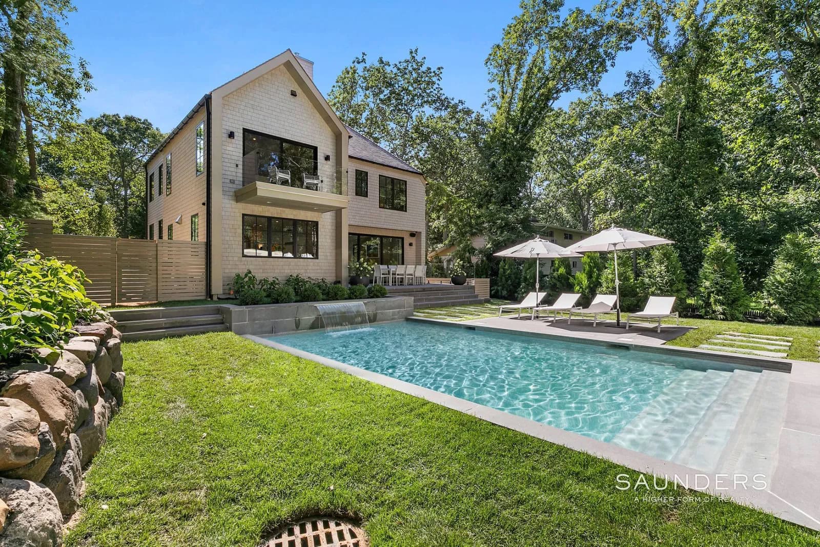 Get ready to enjoy an unforgettable Hamptons Summer experience in this newly constructed Sag Harbor contemporary, just a moments' walk to the powdery sands of (private) Ninevah Beach, complete with mooring rights. This remarkable rental is furnished with chic decorations by the renowned decorator Elsa Soyars'. This 5-bedroom has everything you'll need and features the finest finishes and amenities, from custom fireplaces to the detached pool house with a full wall of glass overlooking the heated pool.