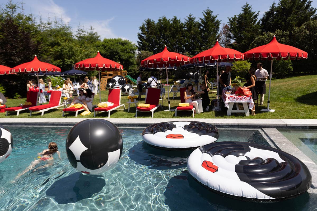 Last week, Stacey Bendet held a stunning poolside celebration at her Watermill home, signaling the official start of the summer season. DJ Jordan Emanuel from Bravo's Summer House kept the energy high while guests sipped on LALO cocktails and Wölffer's iconic wines. Guests were treated to custom bikini charms by Dorne, lymphatic massages, games of beer pong, and a Farmers Daughter Pop-up. 